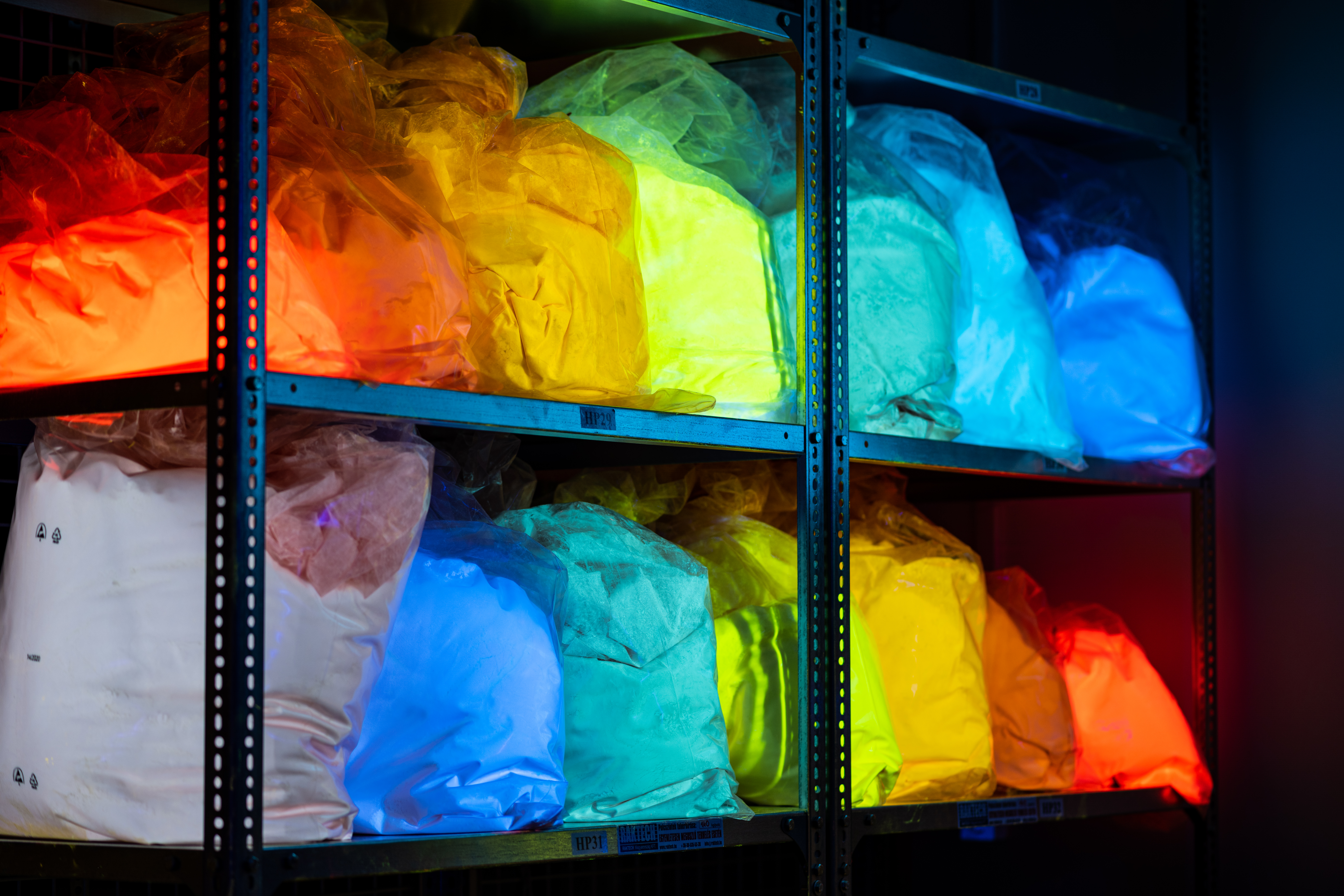 UV fluorescent pigment bags glowing in storage